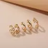 Anillo de tamaño asimétrico clásico simple de gran venta, de aleación lisa, con clip de oreja redondo doble, tipo C