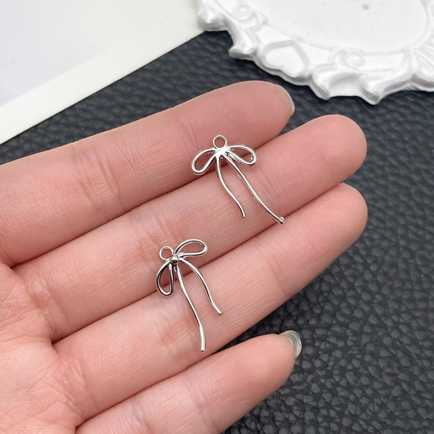 21399-DL-白k保色锌合金蝴蝶结20x12mm-0.4