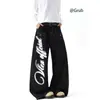Jeans americano retrô de corte curvo desconstruído, estilo outono e inverno, design de alta costura, caimento solto, modelagem que afina a silhueta, calça pantalona ampla com caimento fluido