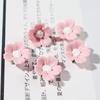Cinco pétalos Cerámica Colorido Flor de Cerezo Accesorios Funda para Teléfono Móvil Pegamento de Crema diy Material Accesorios Pegamento Decoración Mayoreo