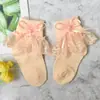 Meias de renda para meninas Primavera e Outono Meias infantis de algodão real cor sólida meias de princesa de renda meias de bebê meninas atacado