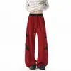 Calça casual masculina com design patchwork de outono, versátil e moderna, com detalhes rasgados, estilo wide-leg high-street color block, nova coleção 2026