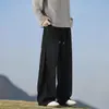 Pantalones de chándal grises pesados de corte inclinado de marca moderna estilo americano para hombres y mujeres, corte holgado, adelgazantes, pantalones deportivos casuales de pierna recta de alta costura para otoño