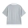 Yidao Vintage 2026 Verano Nuevo Estilo Japonés Moderno Sencillo Versátil Bloque de Color Falso Dos Piezas Holgado Cuello Solapa Manga Corta Camiseta para Hombre