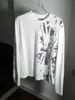 2026 Principios de Otoño Punk Americano Retro Estampado Moteado Gris Claro Camiseta de Manga Larga para Hombres y Mujeres Cuello Redondo Corte Ajustado Versátil Moderna Marca