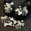 2026 Nueva Moda Gama Alta Plata Mariposa Niña Corazón Agujero Zapatos Accesorios DIY Decoraciones Pedrería Dijes para Zapatos