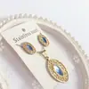 Nuevo especial transfronterizo explosión de tendencia europea y americana titanio acero alta calidad color collar pendientes traje femenino joyería de concha real