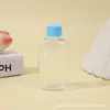 Tapa giratoria Botella de plástico PET transparente Botella de plástico Universal para dulces y cosméticos Embalaje Botella Venta al por mayor Tarro de plástico desechable