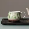 A nova caneca de cerâmica com melancia pintada à mão da Miyan é uma caneca de escritório de alto valor com alça, adequada para o chá da tarde ou café.