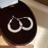 Anillo de perla con cierre de plata, aretes de perla en forma de corazón, aretes de diseño único, lujo ligero, aretes versátiles de alta gama para mujer al por mayor