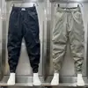Pantalones pitillo cropped para hombre con cordón en el tobillo 2023 Verano nuevos con línea brillante overol personalizado pantalones tipo harén versátiles que estilizan
