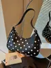 Bolso bandolera versátil de color block de lunares de alta gama transfronterizo para mujer, nuevo en 2026, bolso tipo dumpling exquisito y súper popular