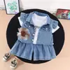 Conjunto de Ropa de Verano para Niñas 2026 Nuevo Elegante y de Moda Conjunto de Tres Piezas de Mezclilla Manga Corta para Bebés, Venta al por Mayor de Ropa de Verano