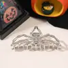 Europeo y Americano Calavera Garra Metal Araña Pinza de Tiburón Grande Accesorios para el Cabello Estilo Oscuro Pinzas para el Cabello Pinza