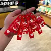 2026 Llavero Perro Rojo Pequeño Indestructible Más Vendido Colgante Perro Rojo Pequeño Herido Dedo Medio Maligno Regalo Venta al por Mayor