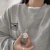 Estilo Ins Creativo Colgante de Acero de Titanio con Expresión Flip para Hombres y Mujeres Literarios Colgante Giratorio de Cara Sonriente de Moda Joyería Hip-Hop