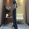 Jeans de pierna ancha retro americanos en negro y gris para mujer, nuevo estilo primavera 2026, pantalones rectos holgados y versátiles con dobladillo curvo hasta el suelo