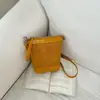 Bolso Pequeño Transfronterizo Nuevo Verano 2026 para Mujer, Bolso Cubo, Bolso de Hombro Cruzado Versátil de Patrón Tejido de Lujo Ligero de Alta Gama