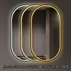 Espejo de baño inteligente ovalado en stock con lijado exterior e iluminación LED translúcida, adecuado para montaje en pared de baño y proyectos hoteleros, con opciones de personalización.