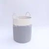 Fabricantes de fuentes originales, venta al por mayor, cesta de almacenamiento de ropa sucia con cuerda de algodón reforzada de ocho hebras, arroz gris, mapa de escena blanco, comercio exterior