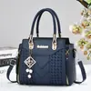 Bolsas transfronteiriças bolsas femininas 2026 novo estilo bolsas de mão para meia-idade elegantes versáteis bolsas de ombro único transversal bolsas tote com toque de alta qualidade