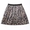 Falda retro americana con estampado de leopardo para mujer, nuevo estilo otoño e invierno 2026, estilo chica picante, de cintura alta, anti-exposición, mini falda bodycon de línea A