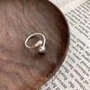 Anillo de plata de ley s925 Shenzhen gota de agua diseño de nicho femenino sentido de la personalidad simple moda anillo abierto bola anillo de comida