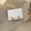 Pendientes de Diseño de Nicho de Lujo Ligero Estilo Francés Pendientes Dulces Frescos de Corazón Pendientes de Botón Versátiles de Moda de Gama Alta