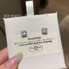 Venta al por mayor de fábrica suministro en vivo aretes de plata s925 incrustados con material natural peligroso jadeíta verde yang azúcar pequeños frescos para mujer