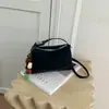 Elegante y chic bolso de mano tipo dumpling para mujer, nuevo modelo otoño e invierno 2026, patchwork de estampado de leopardo de lujo ligero para uso diario, bolso de hombro y cruzado