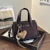 Bolsa de ombro grande de camurça 2026 para o dia a dia de mulheres, moda de nicho de alta qualidade, bolsa tote de pelúcia cor sólida