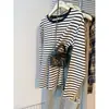 Tmall TikTok calidad entrega Primavera y Otoño estilo coreano talla extra suelta algodón cuello redondo rayado manga larga camiseta top para mujer