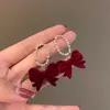 Pendientes de Perlas con Lazo Rojo para Otoño e Invierno Pendientes de Alta Gama para Mujer 2025 Nuevo Estilo Chino Pendientes Rojos