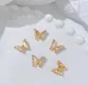 Accesorios metálicos para decoración de uñas de ojo de gato mariposa de circonita, decoración de uñas de aleación de rhinestone tridimensional súper brillante, colores oro y plata con goteo de aceite