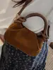 Bolso pequeño cuadrado de color liso estilo coreano para mujer, nuevo diseño 2026 casual y apto para el trabajo, bolso de hombro o bandolera simple y retro