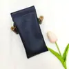 Bolsa de armazenamento novo em estoque cor sólida couro bolsa para óculos óculos de sol óculos de sol estilhaço fecho automático bolsa para óculos
