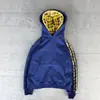 Otoño e invierno moda europea y americana personalidad doble capucha bloques de color simple holgada alta calle cuadros retazos sudadera con capucha al por mayor