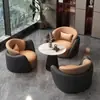 Conjunto minimalista y lujoso de sofá individual y mesa de centro, adecuado para uso casual en hoteles, salones de belleza, áreas de recepción y centros de exposiciones; también incluye un juego de mesas y sillas para reuniones y discusiones