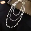 Collar de perlas con cuentas de Saturno multicapa vintage francés, cadena para la clavícula moderna y sofisticada, collar versátil exquisito de nicho