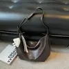 Bolsa feminina texturizada estilo vintage, nova bolsa transversal casual versátil para o dia a dia outono 2026, bolsa de ombro de grande capacidade