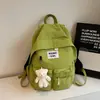 Mochila estilo universitário coreano para mulheres, grande capacidade, leve, bolsa escolar para estudantes com pingente de urso, adequada para viagens e deslocamento