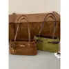 Bolsa de ombro feminina de grande capacidade, estilosa e moderna, com um design único, perfeita para o trabalho e para o dia a dia.; uma bolsa de ombro chique e casual