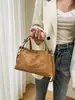 Nuevo bolso de hombro retro de gamuza 2026 para mujer, un bolso tipo almohada para la axila elegante y versátil, perfecto para ir al trabajo y se puede llevar como bolso de mano o cruzado