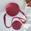Bolsas para Mujer 2025 Nueva Color Sólido Acolchada Bordada Cruzada Pequeña Redonda con Billetera Moda Comercio Exterior Mayoreo