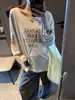 Camisa Base Feminina Manga Longa Solta Gola Redonda com Design de Alças Cruzadas nas Costas Favorita da Mochie Fashionista MQ1946