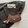 Nuevo bolso de hombro de moda transfronterizo para mujer 2026, bolso cruzado y de axila versátil con cadena, estilo simple y chic