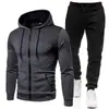 Nuevo conjunto deportivo con capucha de forro polar de color liso europeo y americano para otoño e invierno, sudadera y pantalón de chándal para hombre, casual, con puntos y cierre de cremallera