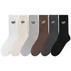 Calcetines de moda para hombre, de media pantorrilla, con letras, desodorantes, informales, deportivos, para otoño e invierno.