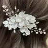 Nuevo tocado de boda nupcial coreano transfronterizo europeo y americano pétalo de concha blanca hecho a mano perla cristal horquilla decoración