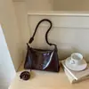 Bolsa casual de nicho Shuai Mi Jia para mujer, nueva bolsa cruzada popular de principios de otoño 2026, bolso simple para hombro y axila